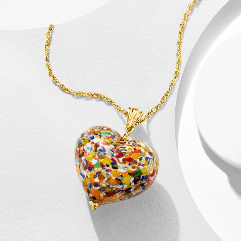 Multicolored Murano glass heart pendant with gold bail, hanging from chain