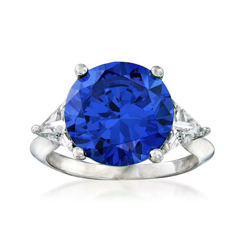 Sterling silver ring with large oval blue simulated sapphire and clear side stones