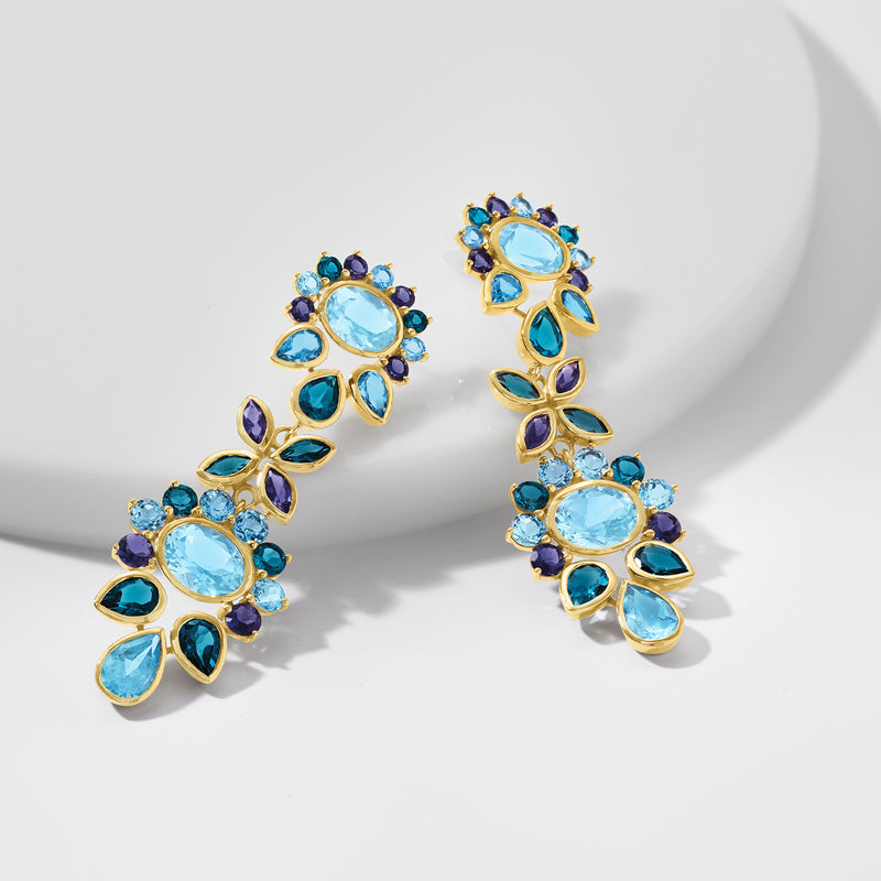 Gold-tone drop earrings with linked clusters of oval light-blue and dark-blue stones