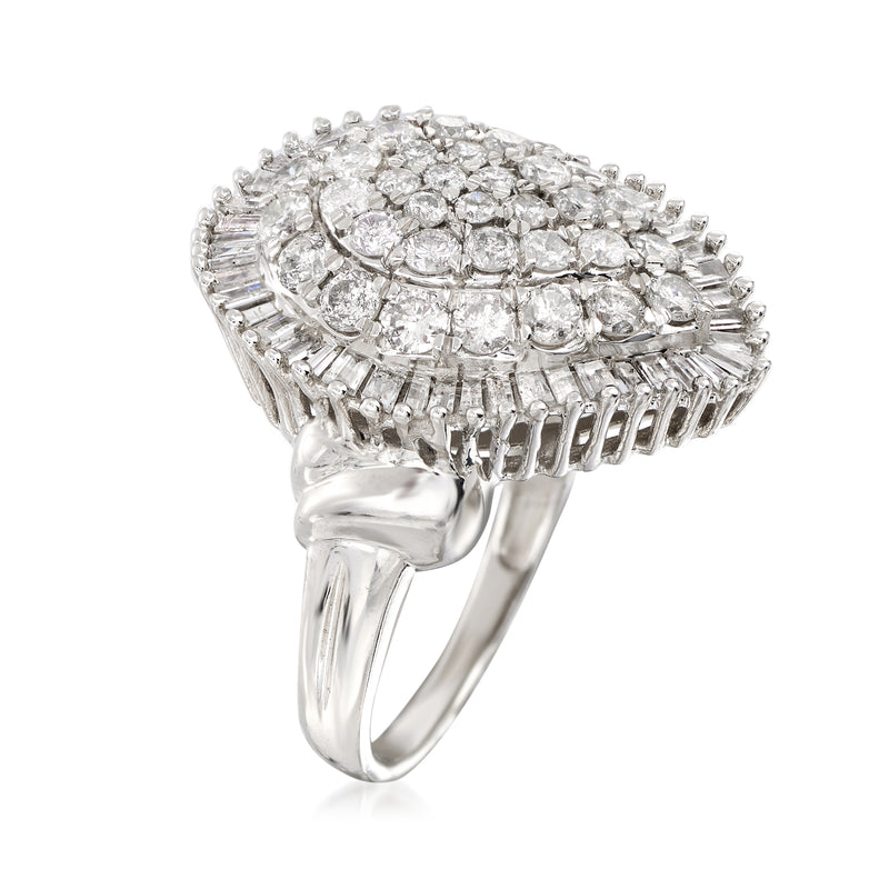 White gold diamond cluster ring side view; pear center with baguette halo