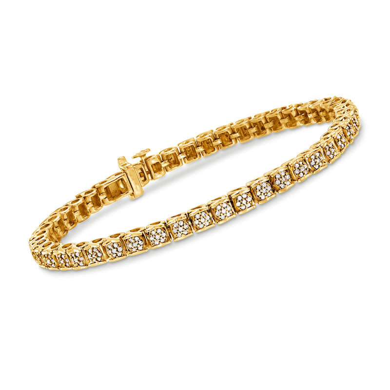 Gold tennis bracelet with two rows of round clear stones and hinged clasp
