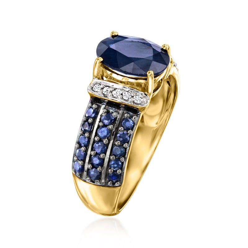 Yellow gold sapphire ring with oval blue center stone and diamond-accented sapphire shank