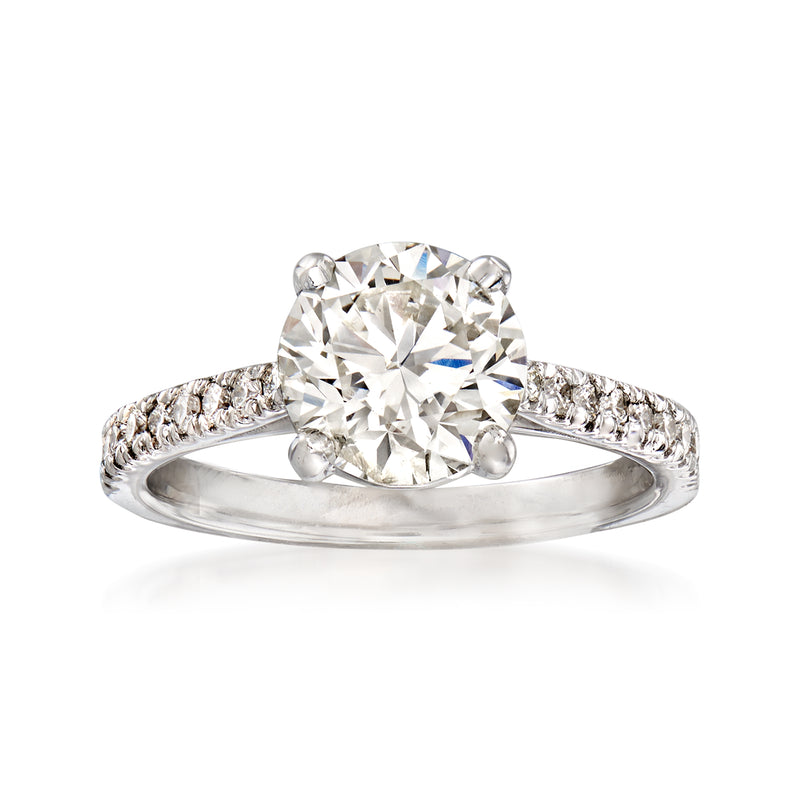 18kt white gold diamond ring with large round center stone and pave band