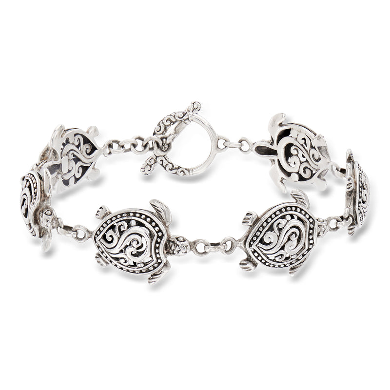 Sterling silver turtle charm bracelet with ornate swirls and link chain