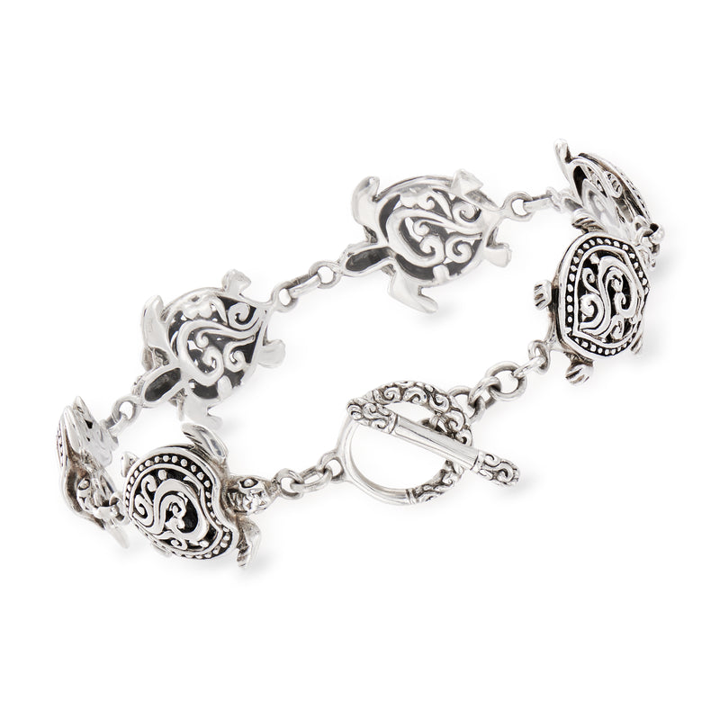 Sterling silver turtle charm bracelet with oval medallions and adjustable clasp