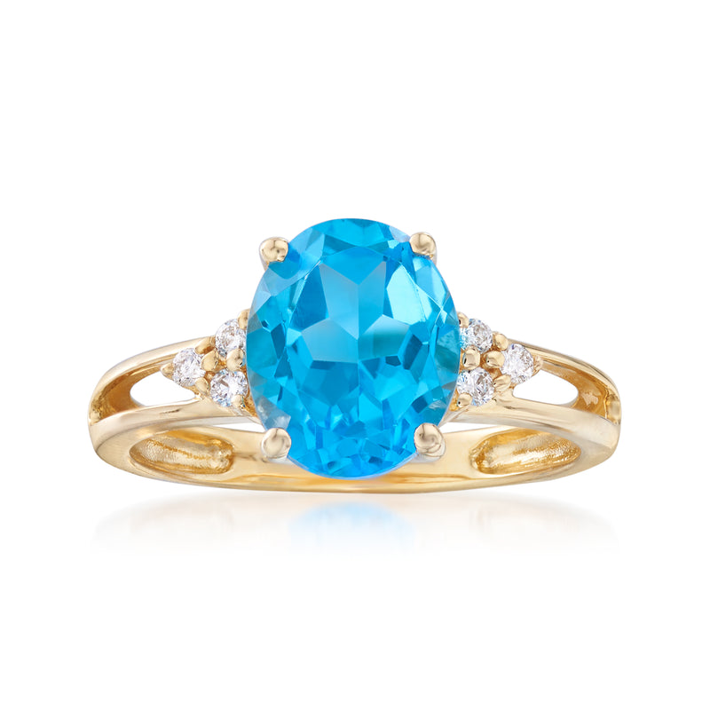 14kt yellow gold ring with large oval blue topaz center and small diamond accents