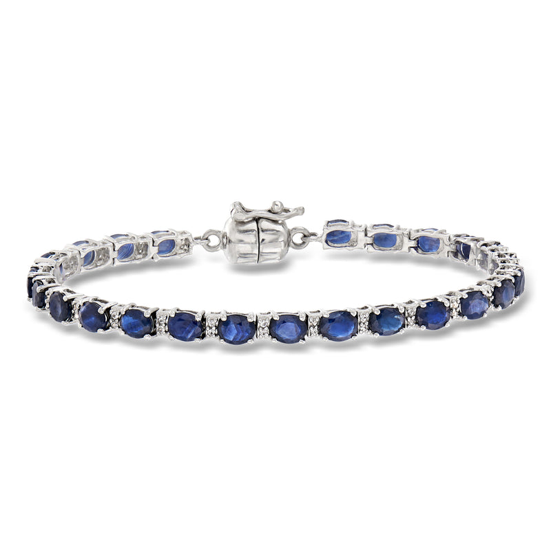 Sterling silver tennis bracelet with blue sapphire-style stones and magnetic clasp