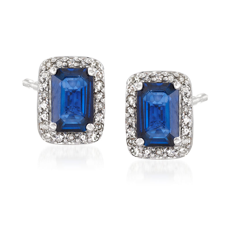 Blue sapphire square halo stud earrings with diamond border, white metal setting.