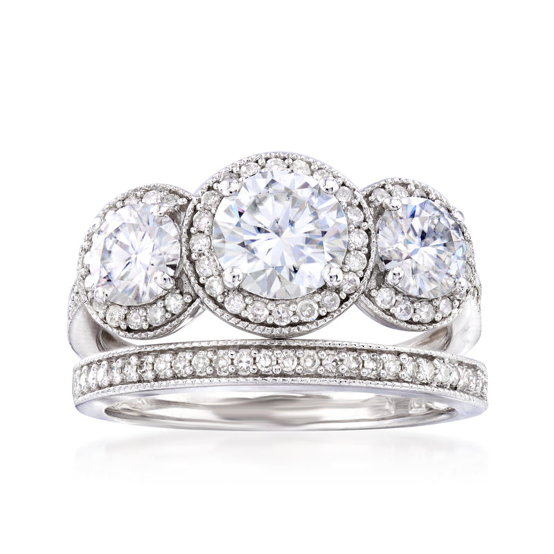 Three-stone moissanite and diamond engagement ring in white gold