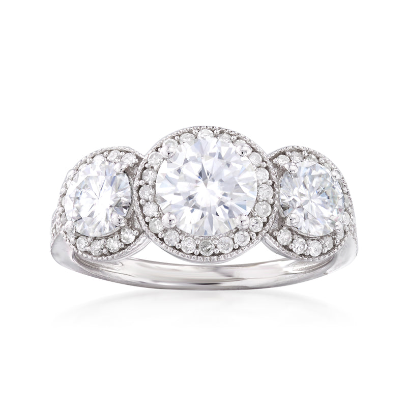 14kt white gold three-stone ring with round center moissanite and diamond halos