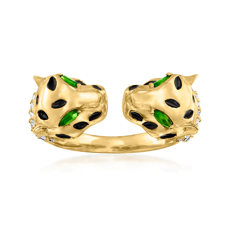 Gold-tone open ring with double leopard heads, white stones, green accents, and black spots