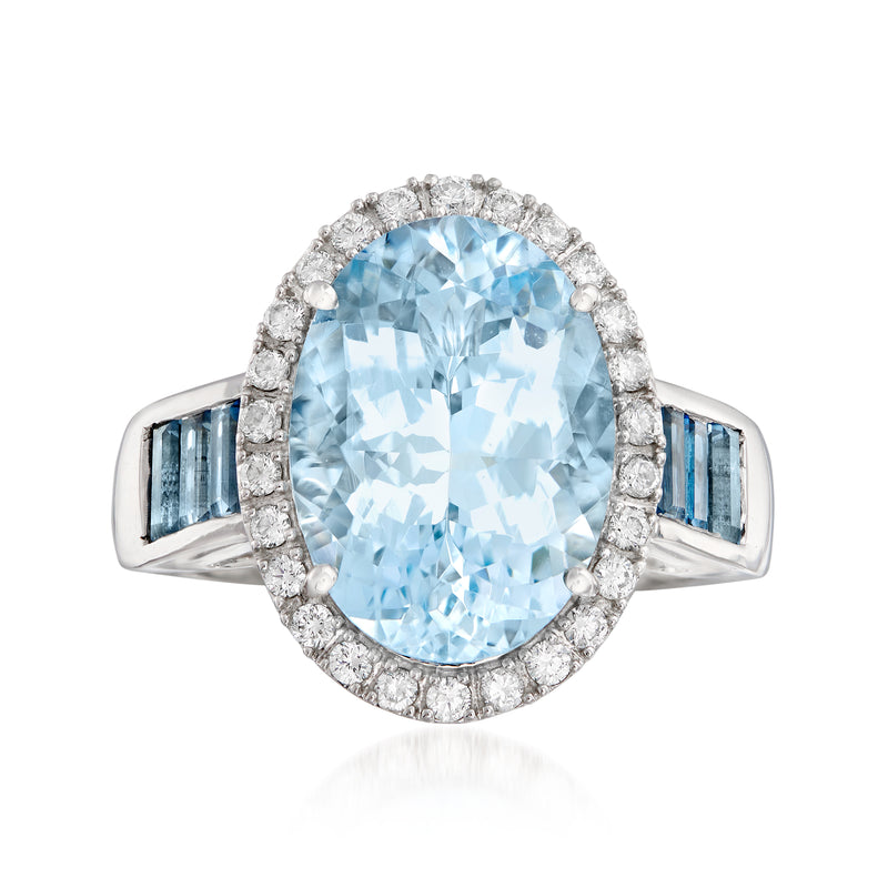 14kt white gold oval aquamarine ring with diamond halo and blue baguette accents