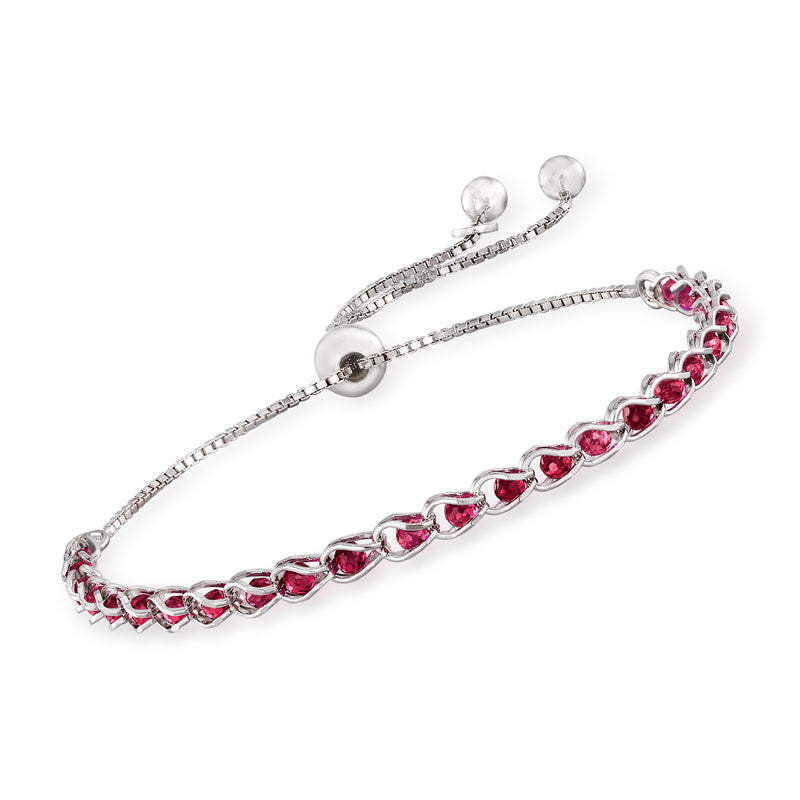 Sterling silver bolo bracelet with red simulated ruby oval beads and rhinestone stations