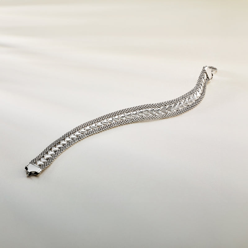 Sterling silver heart-motif chain bracelet with clasp end and woven texture