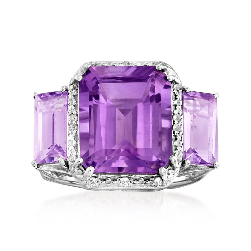 Sterling silver three-stone ring with large rectangular amethyst center and side light purple stones