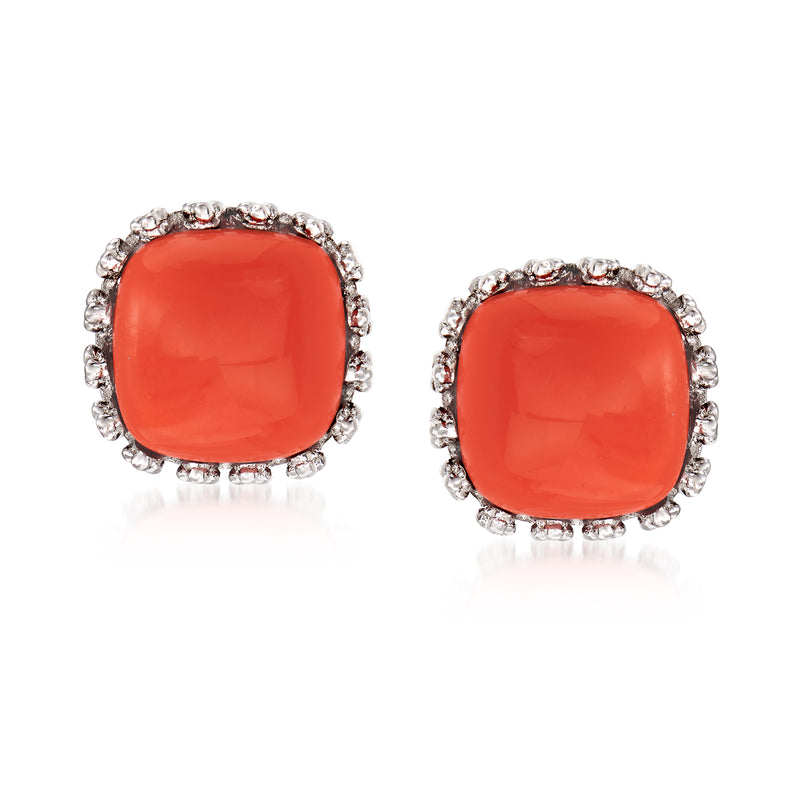 Coral red cushion stud earrings with silver halo and prong details