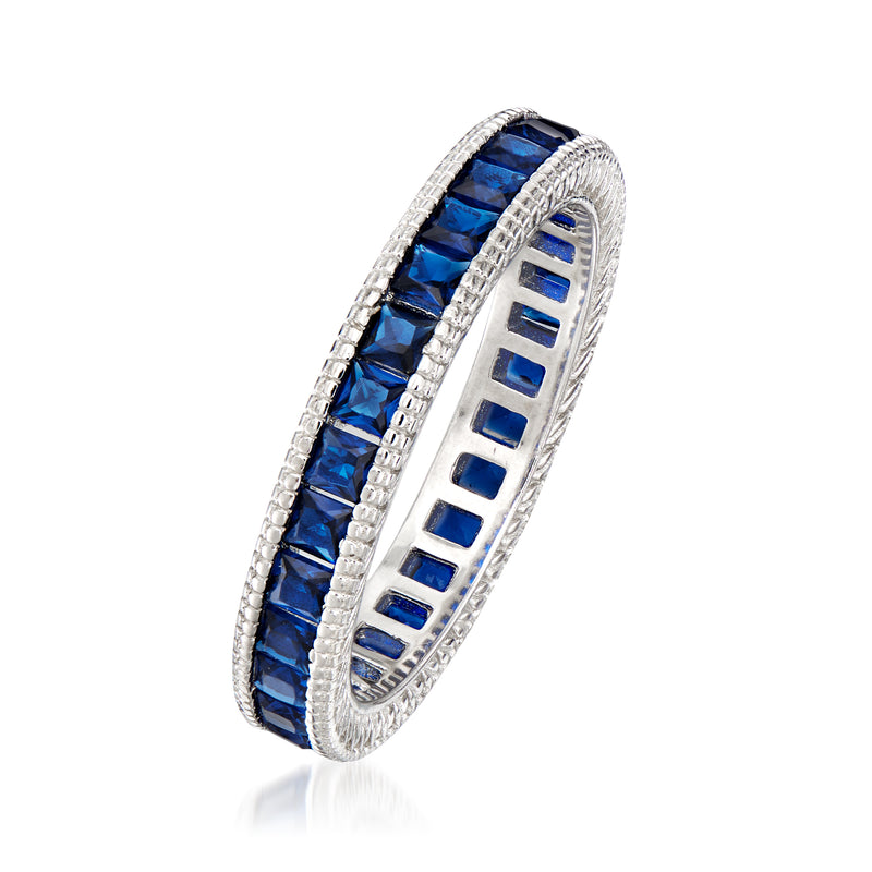 Sterling silver simulated sapphire eternity band with blue stones in channel setting