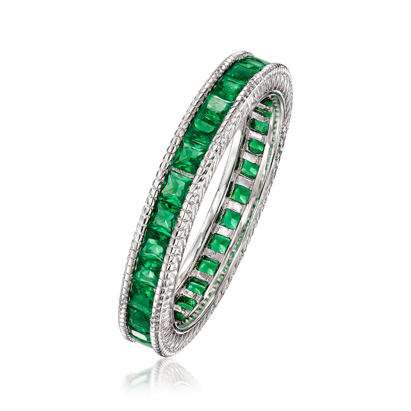 Side view sterling silver eternity band with green channel-set simulated emerald stones