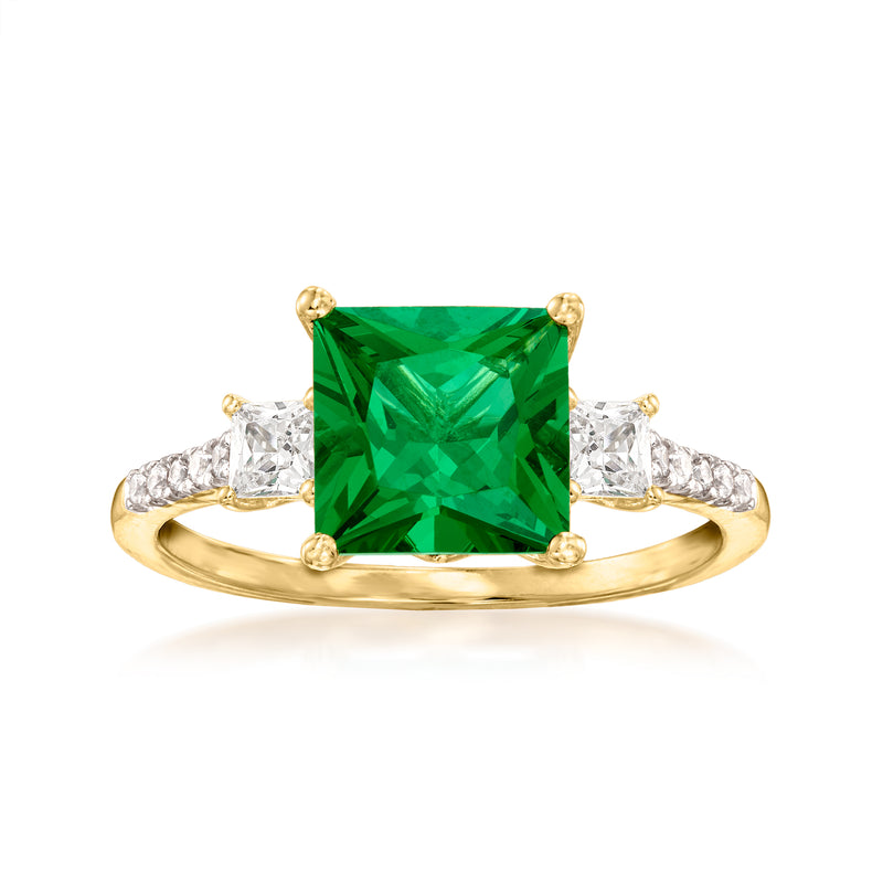 Gold ring with emerald-cut green simulated stone and clear CZ side stones