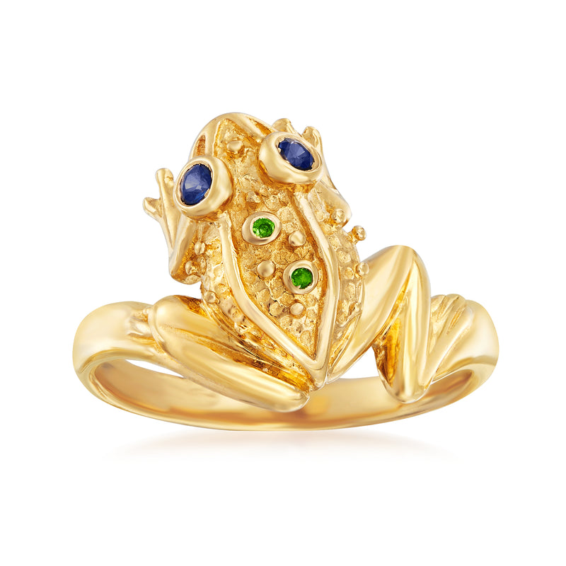 Gold frog-shaped ring with sapphire-blue eyes and green accents, sculpted band