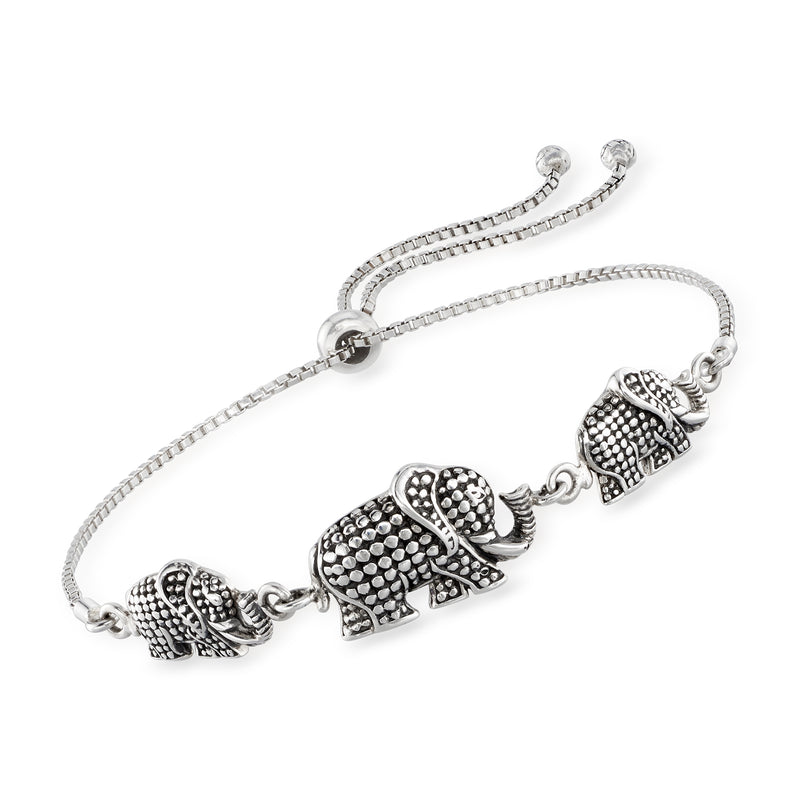 Silver bolo bracelet with three textured elephant charms and adjustable clasp slider.