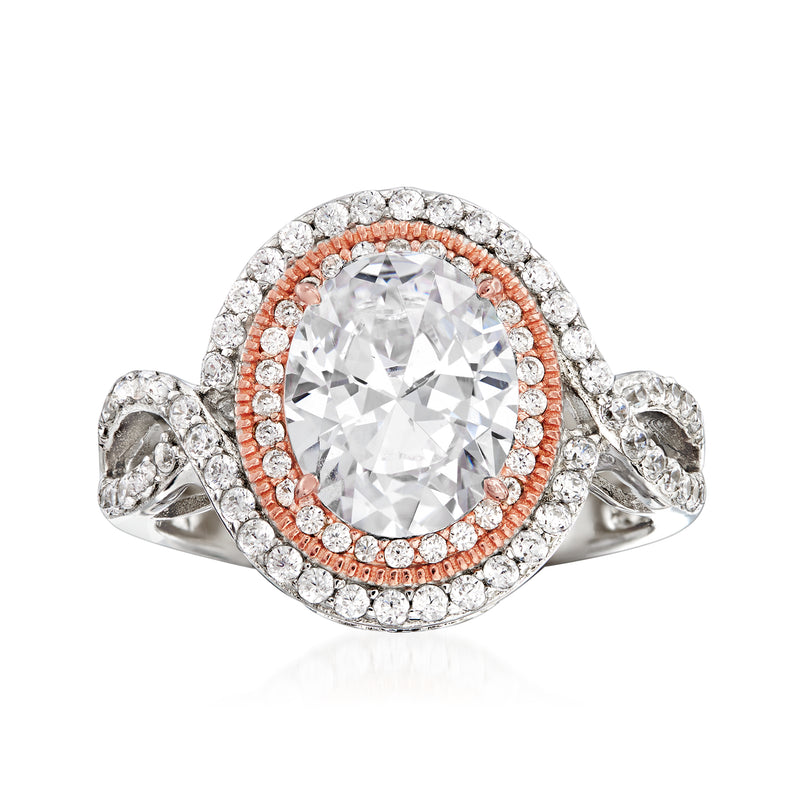 Sterling silver CZ ring with large clear oval center stone and rose-gold-toned halo