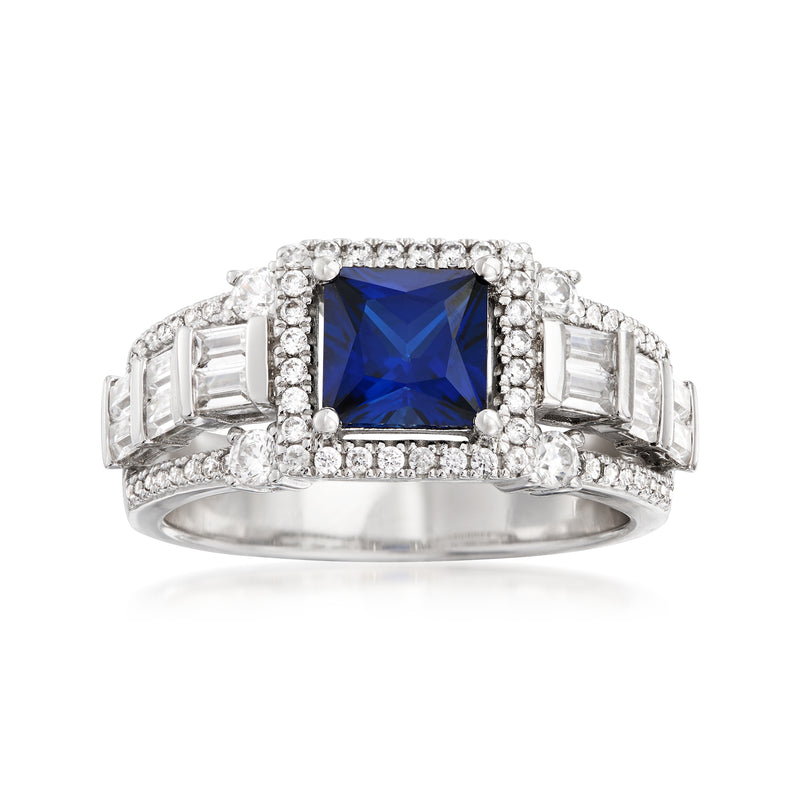 Sterling silver ring with blue simulated sapphire center and CZ halo, rectangular side stones