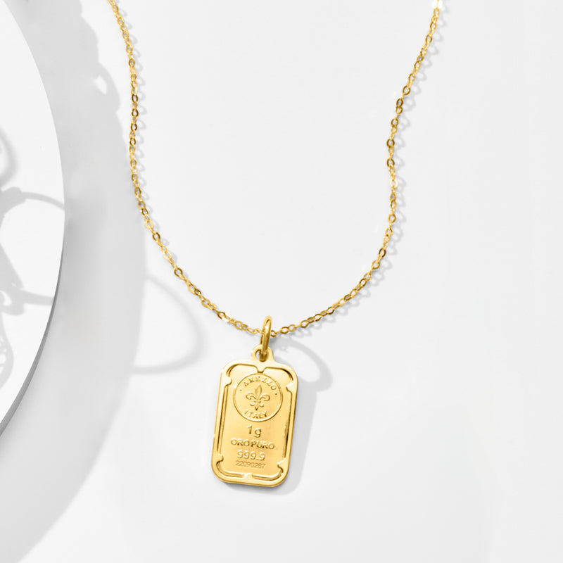 Yellow gold rectangular ingot pendant necklace with loop bail and engraved script
