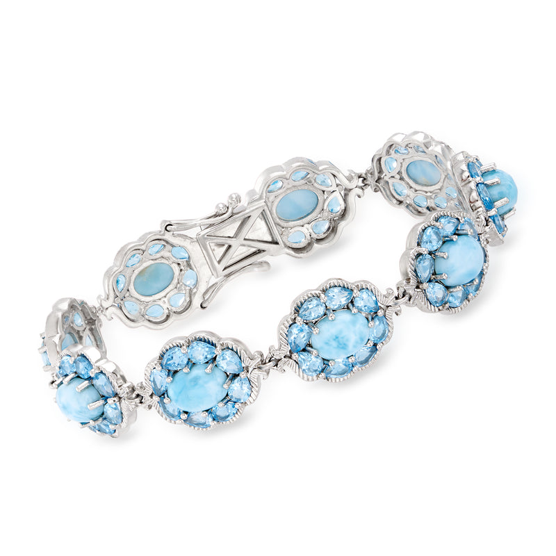 Sterling silver blue oval gemstone bracelet with clustered settings and star accents