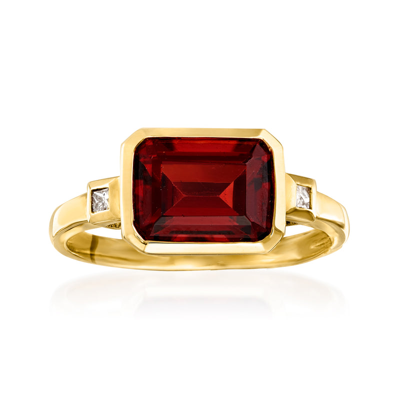 14kt yellow gold ring with red rectangular garnet and two side diamonds