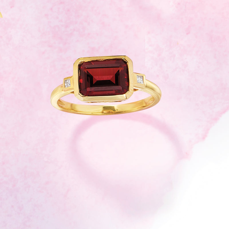 14kt yellow gold ring with deep red rectangular garnet center and small diamonds