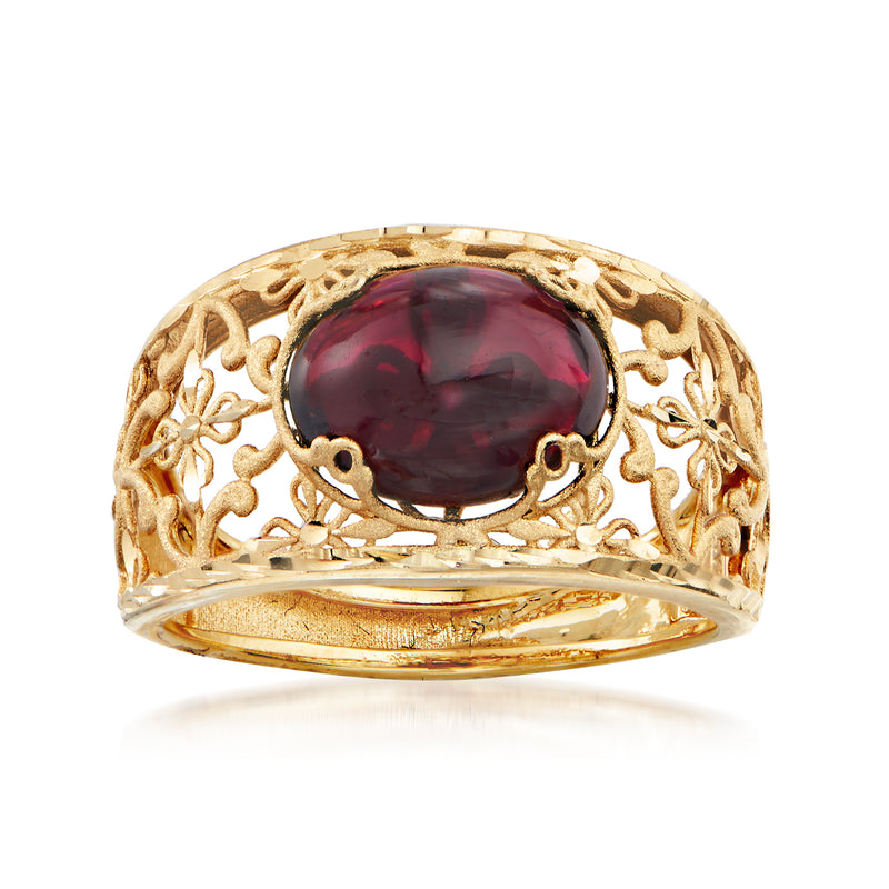14kt yellow gold garnet floral ring with oval red gemstone centerpiece