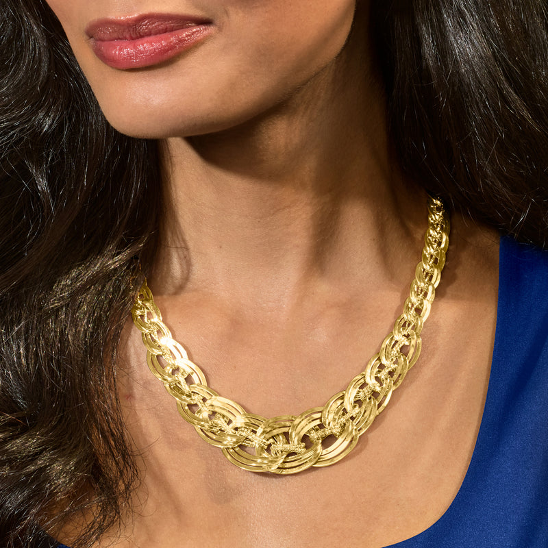 18kt yellow gold interlocking-link necklace worn at the neckline