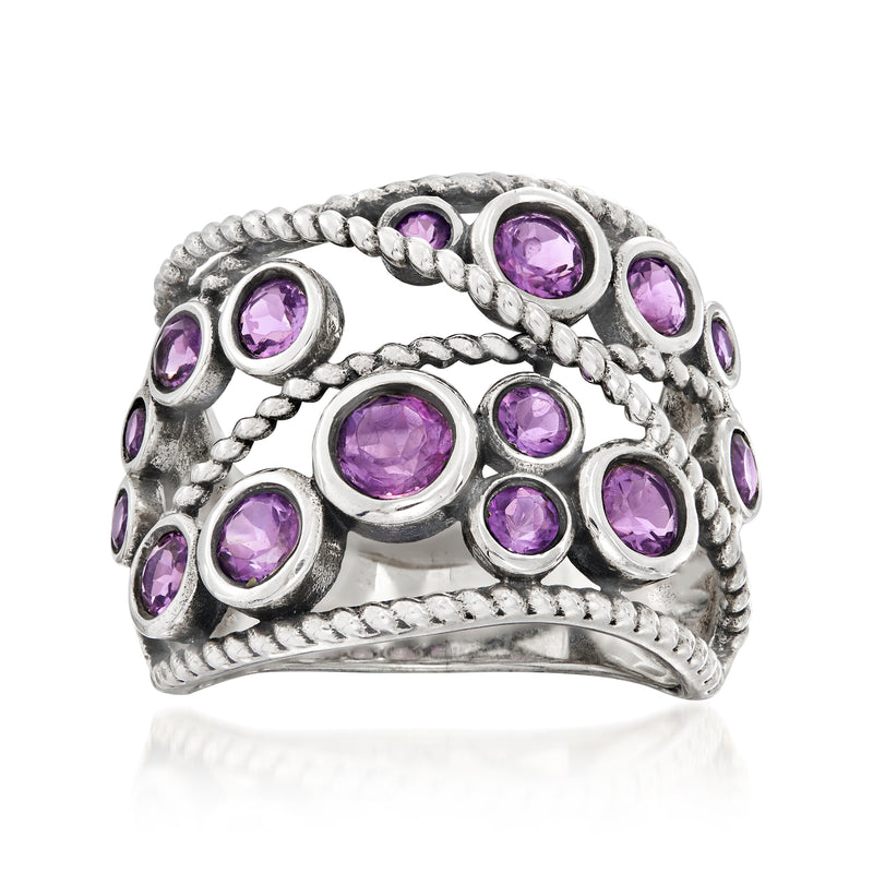 Amethyst ring in sterling silver with round purple gemstones in rope-style bezels