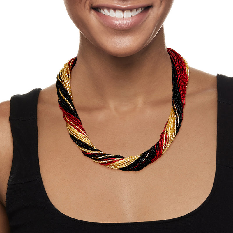 Murano glass bead torsade necklace in red, black and gold worn on neck