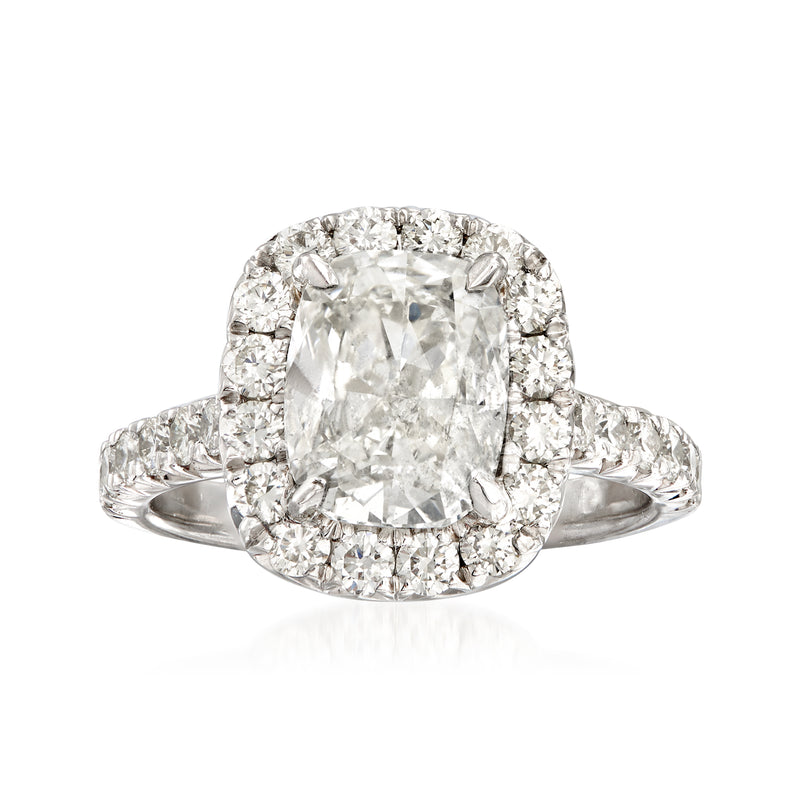 Platinum halo engagement ring with large square-cut diamond center and diamond surround