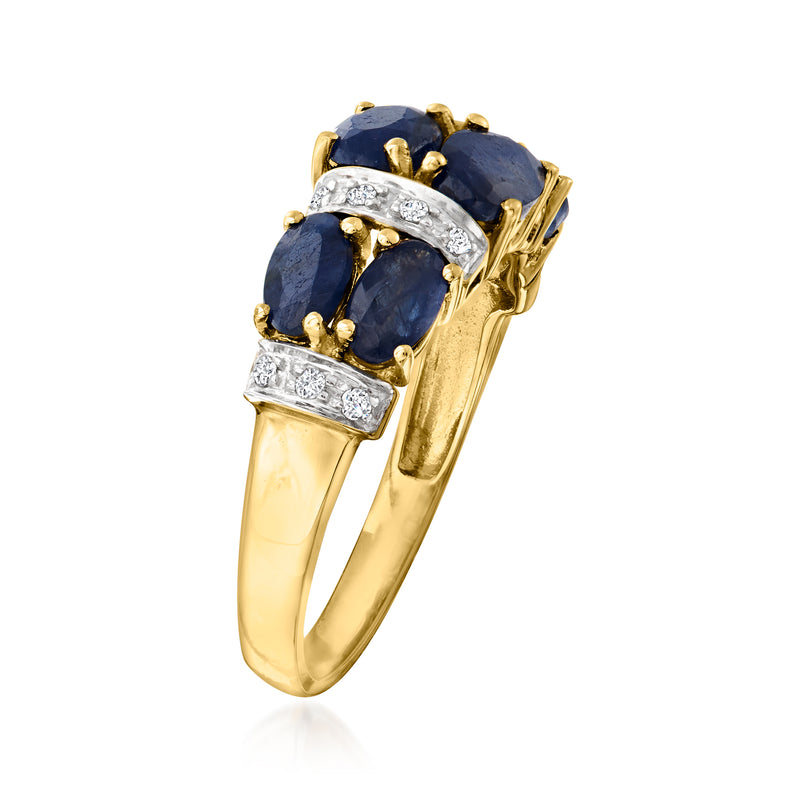 14kt yellow gold sapphire ring with oval blue center stone and diamond band accents