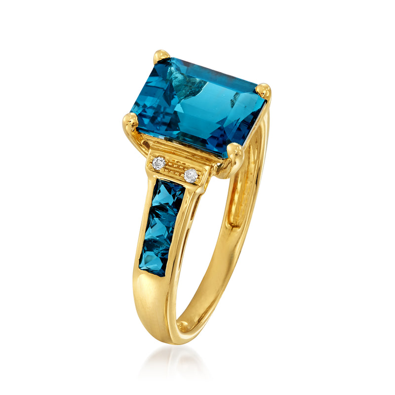 14kt yellow gold ring with large blue topaz square, side blue stones, diamond accents