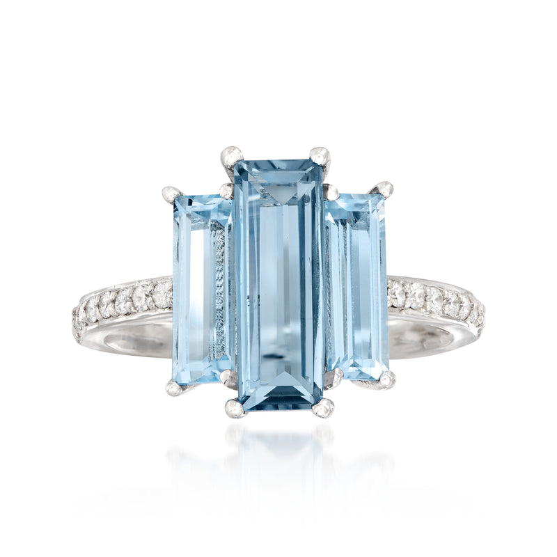 14kt white gold ring with large rectangular blue topaz center and side diamond accents