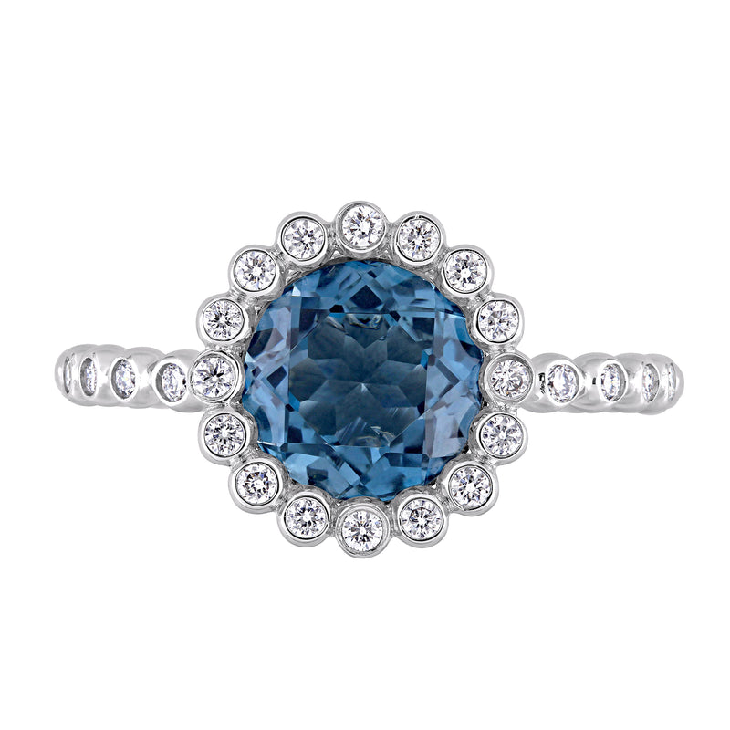 14kt white gold ring with oval London blue topaz and round diamond halo