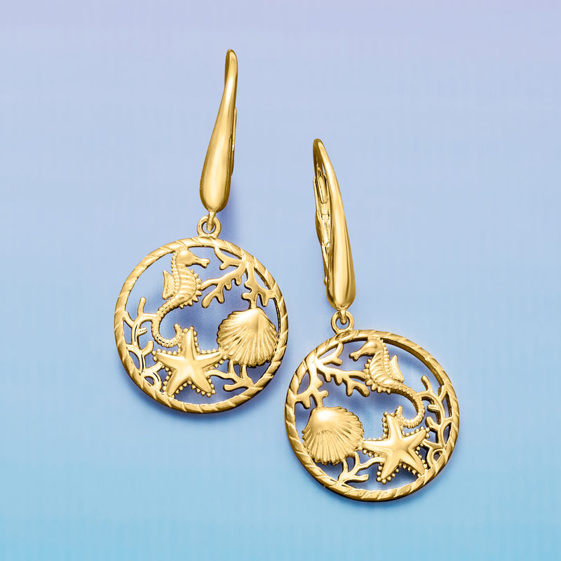 Gold-tone sea life drop earrings with round disc featuring starfish, shell, and coral, leverback