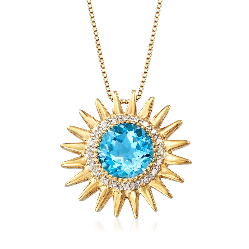 Gold sunburst pendant necklace with blue topaz center and diamond accents