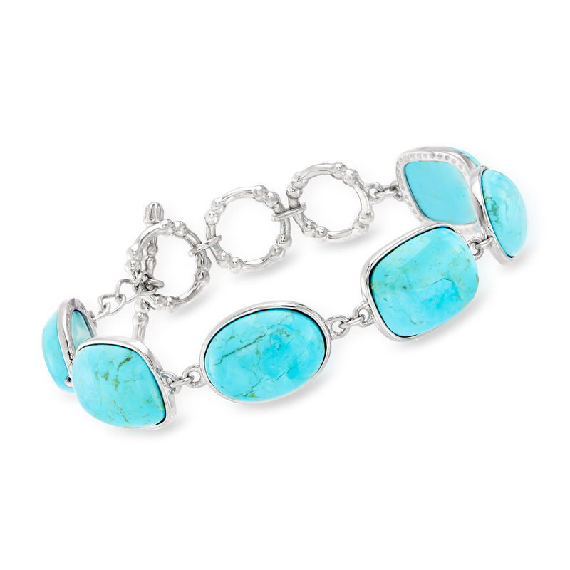 Turquoise link bracelet in sterling silver with oval cabochon stones