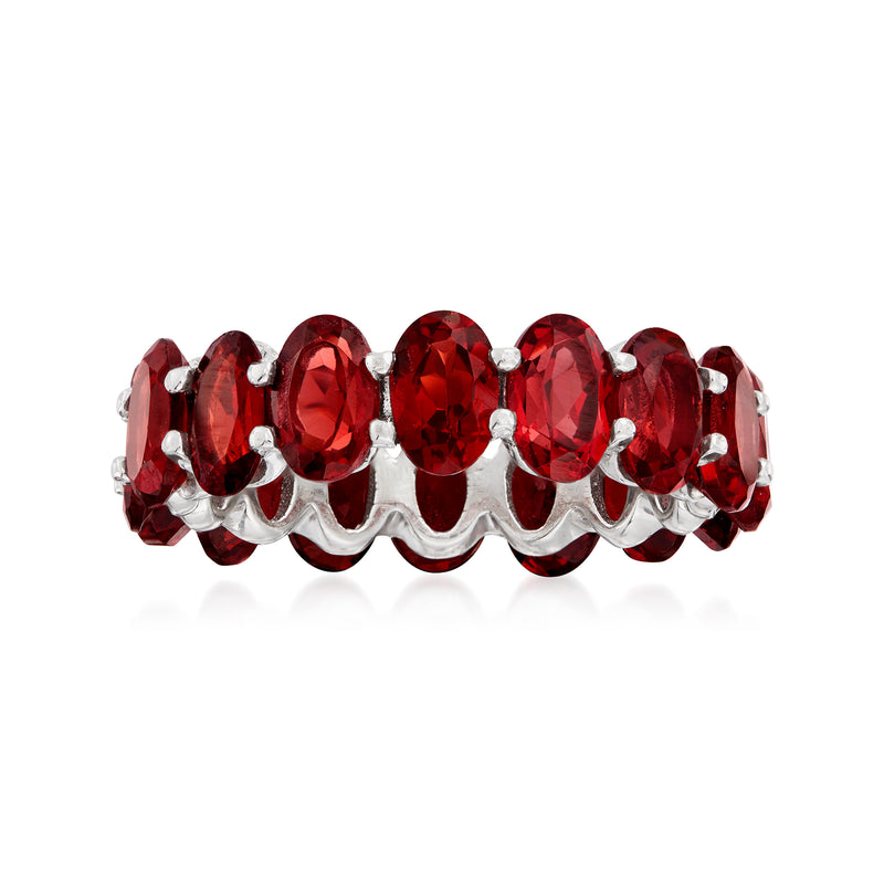 Sterling silver eternity ring with oval red garnet-style gemstones in shared prong setting
