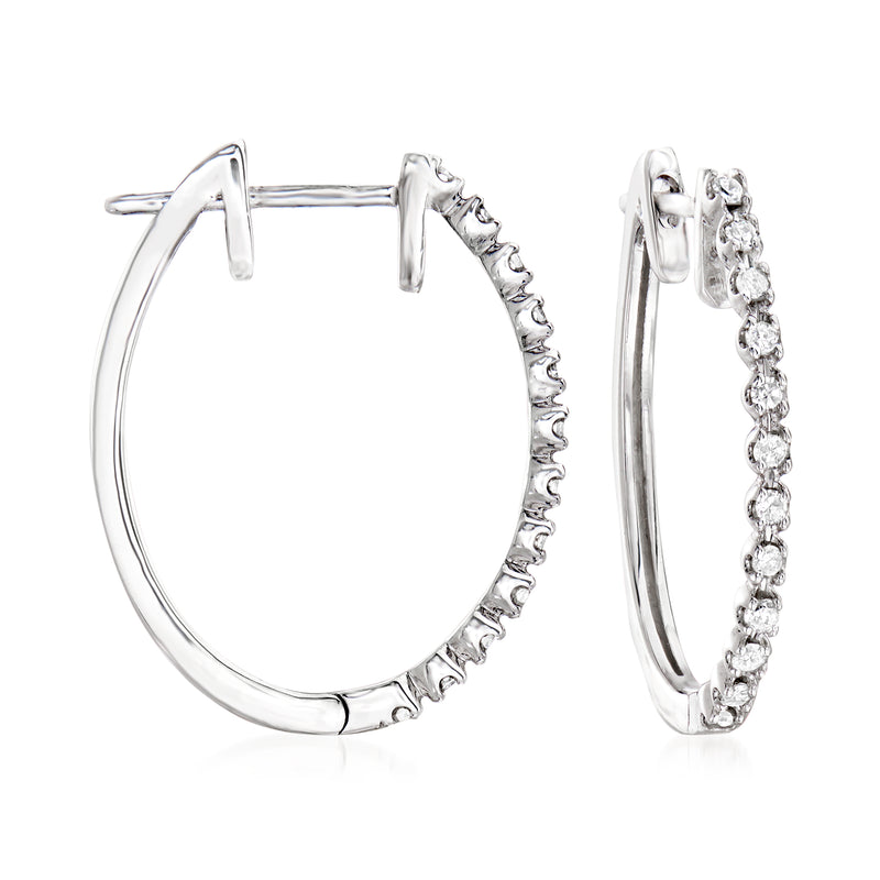 14kt white gold diamond hoop earrings with small round stones along the outer edge
