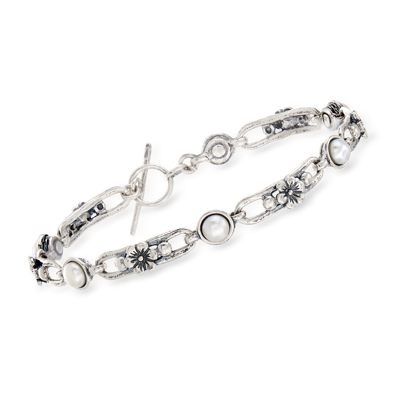 Sterling silver link bracelet with floral charms and round white cultured pearls