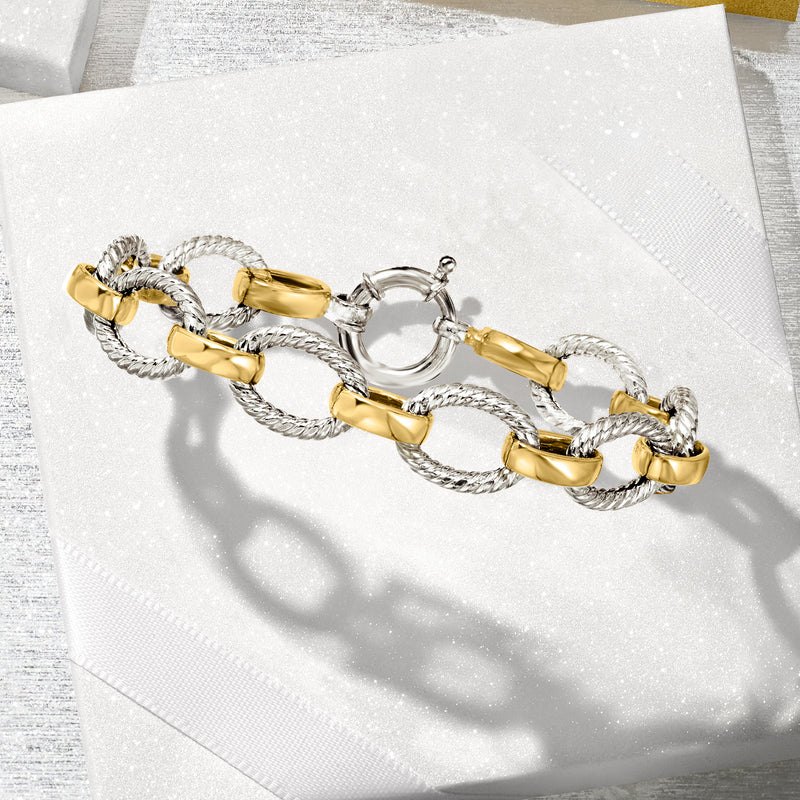 Twisted-oval link bracelet with alternating silver chain and gold-tone bar links