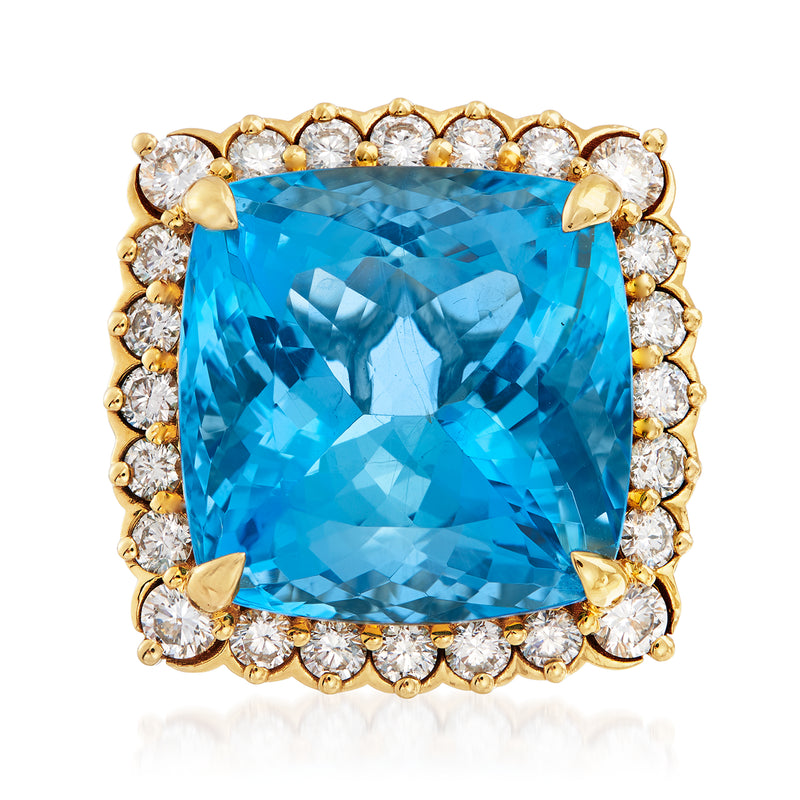 18k yellow gold ring with cushion-cut aquamarine center and diamond halo