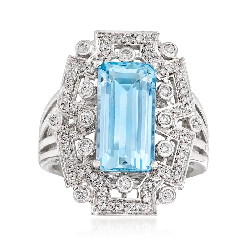 Aquamarine gemstone and diamond halo ring in 14kt white gold, rectangular blue center stone.