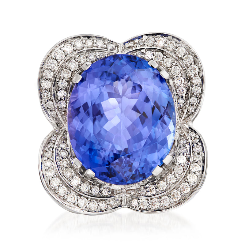 18k white gold tanzanite flower ring with cushion-cut blue gemstone and diamond halo